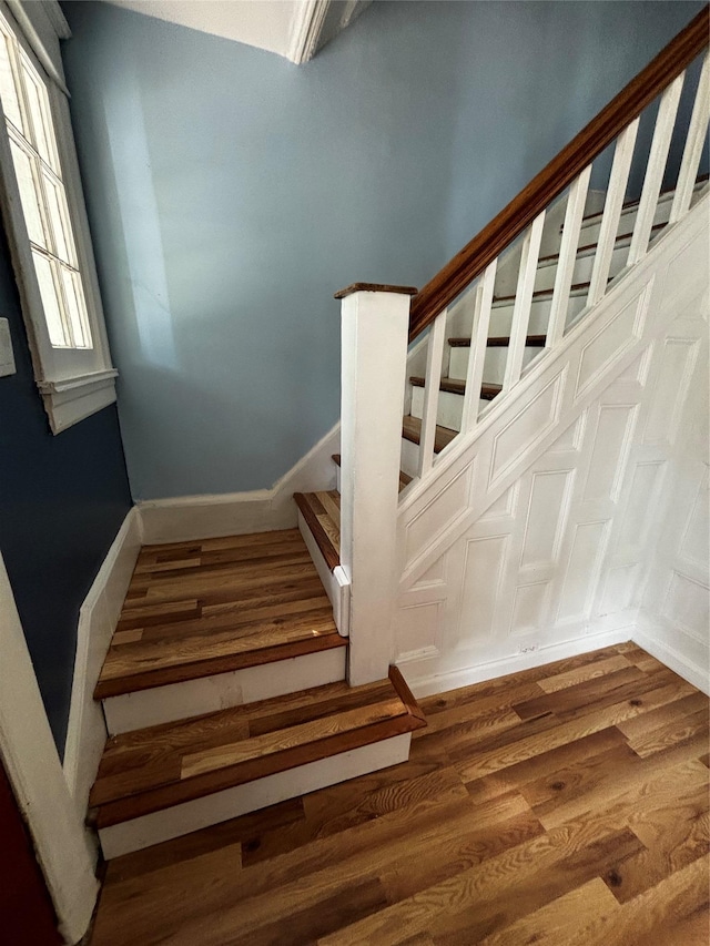 staircase featuring hardwood / wood-style flooring