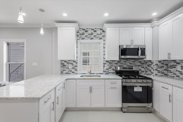 kitchen featuring white cabinetry, sink, decorative backsplash, and stainless steel appliances