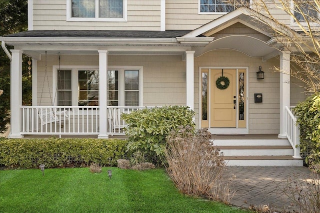 entrance to property featuring covered porch