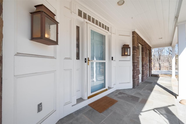 doorway to property featuring covered porch