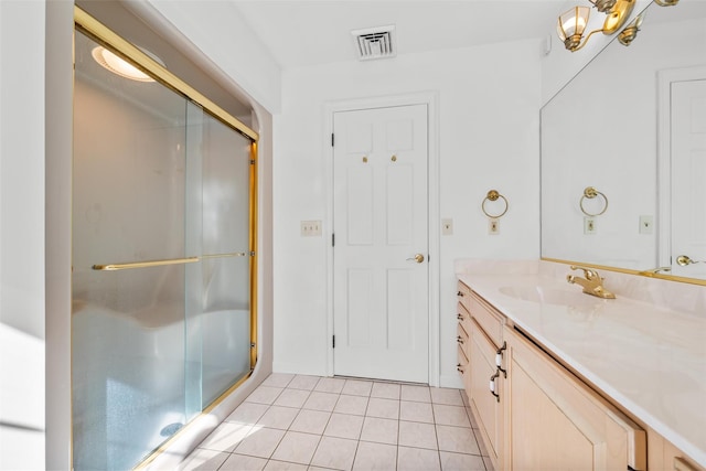 full bath featuring tile patterned flooring, visible vents, a shower stall, and vanity