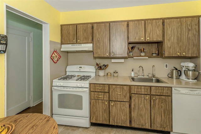 kitchen with white appliances and sink