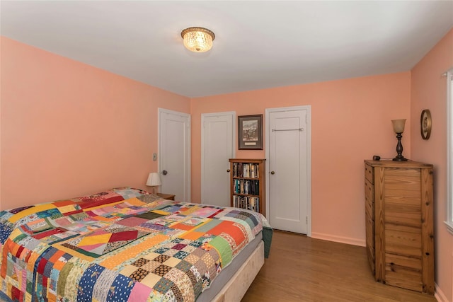 bedroom with wood-type flooring