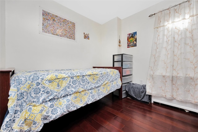 bedroom featuring dark wood-type flooring