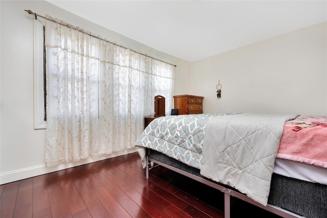 bedroom featuring dark wood-type flooring