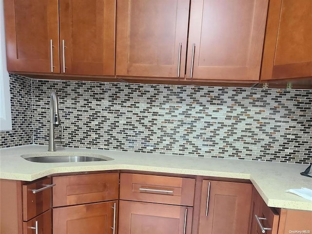 kitchen featuring sink and backsplash