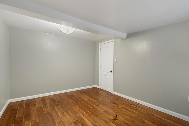 empty room with hardwood / wood-style floors