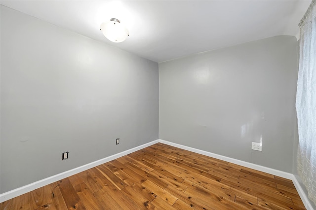 empty room featuring hardwood / wood-style flooring