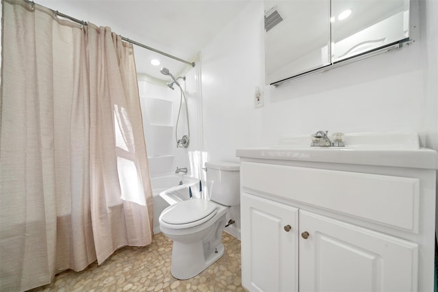 full bathroom featuring shower / tub combo with curtain, vanity, and toilet