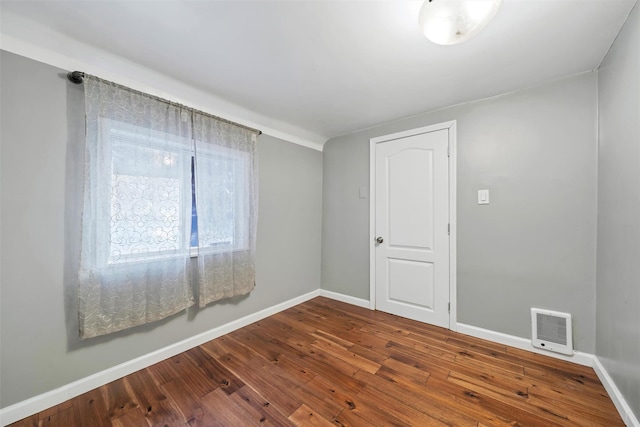 16 Stanton Trl, Monroe, NY 10950 - spare room featuring dark wood-type flooring, baseboards, and heating unit