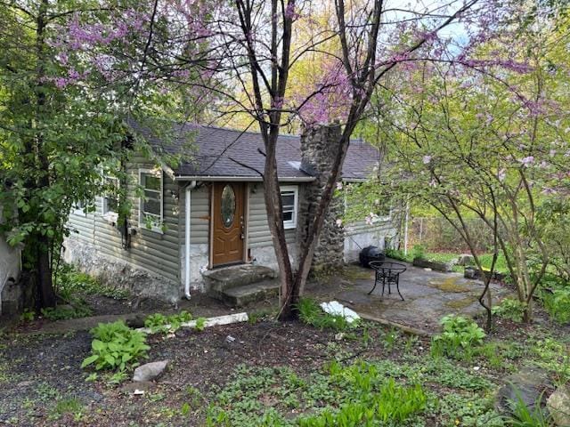 16 Stanton Trl, Monroe, NY 10950 - view of front of home featuring roof with shingles and a patio area