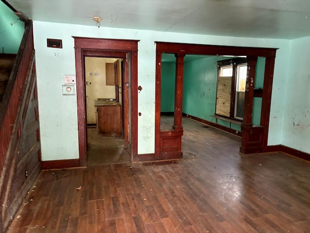 spare room featuring dark hardwood / wood-style flooring