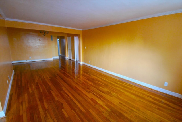 unfurnished room with hardwood / wood-style flooring and ornamental molding