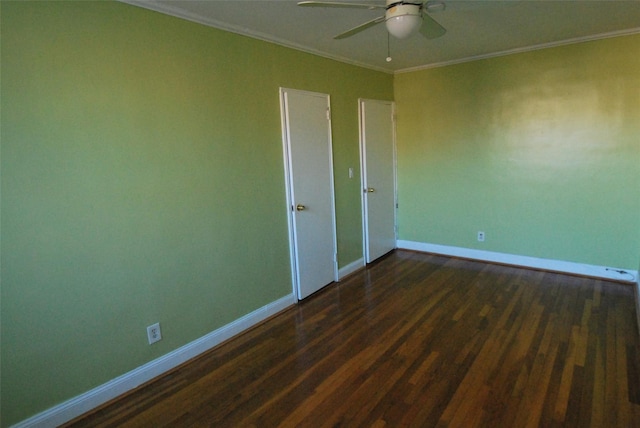 spare room with crown molding, ceiling fan, and dark hardwood / wood-style flooring