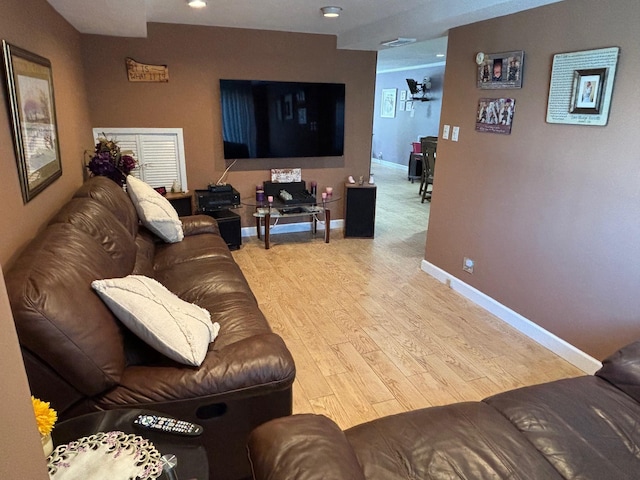 living room with light hardwood / wood-style floors