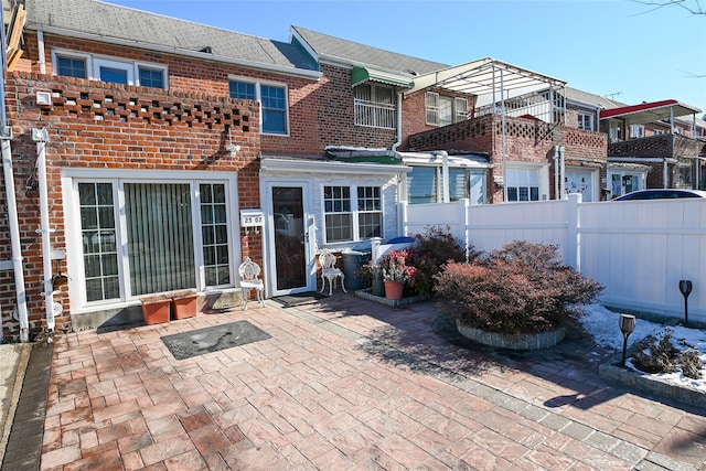 rear view of house with a patio