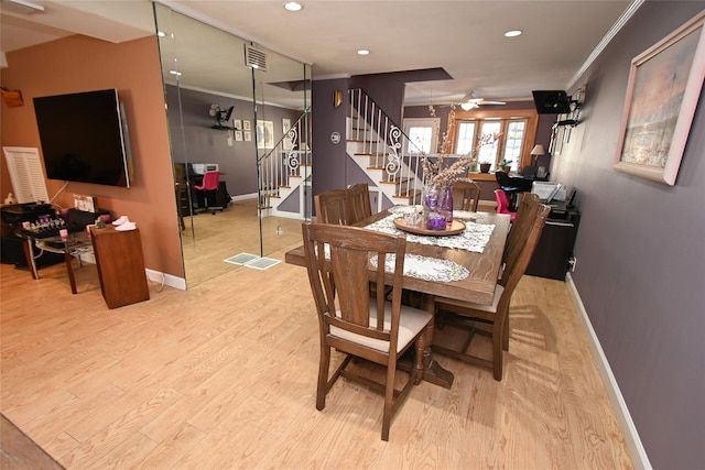 dining room featuring crown molding, ceiling fan, and light hardwood / wood-style flooring