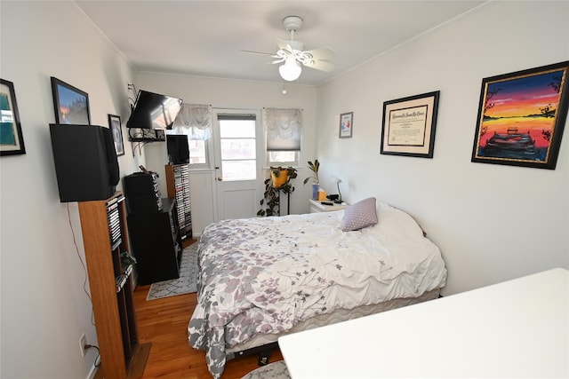 bedroom with wood-type flooring and ceiling fan