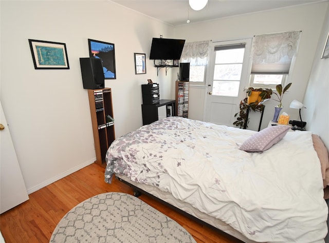 bedroom with hardwood / wood-style floors