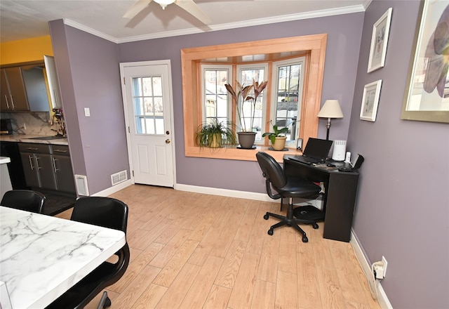 office area with sink, plenty of natural light, ornamental molding, and light hardwood / wood-style floors