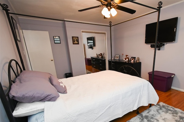 bedroom with hardwood / wood-style flooring and ceiling fan