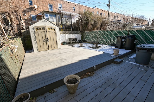 wooden terrace with a shed