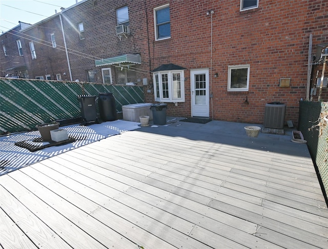 wooden deck with a patio and cooling unit