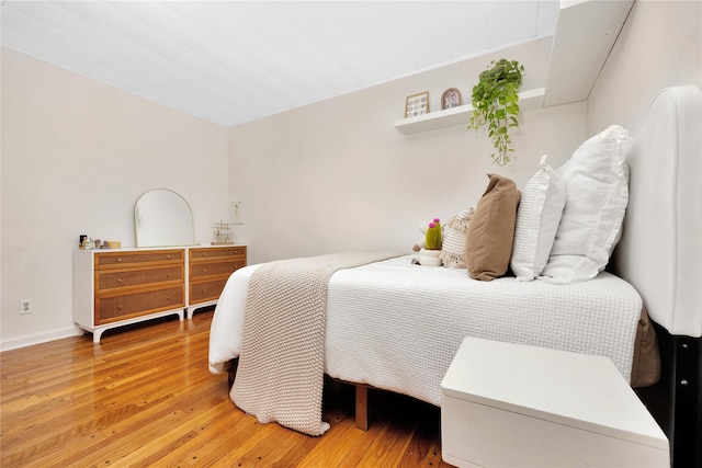 bedroom with hardwood / wood-style flooring