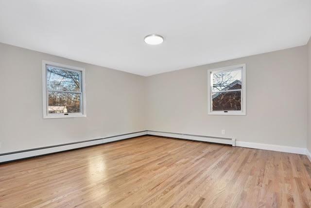 spare room with light wood-type flooring