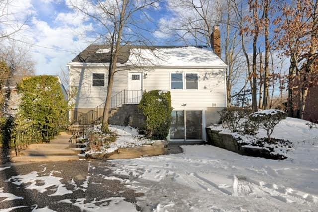 view of front of property featuring a chimney