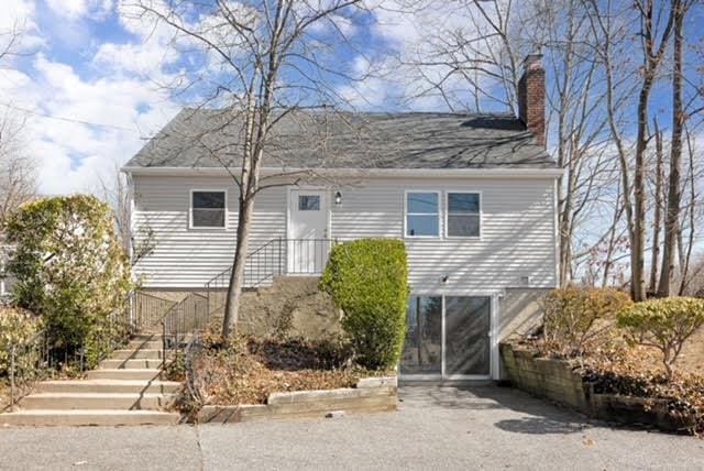 view of front of house featuring a chimney