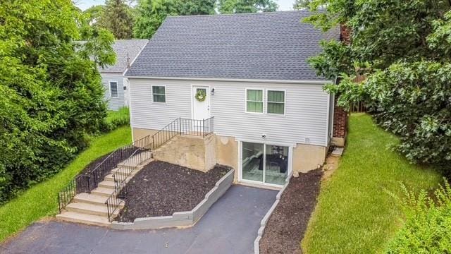122 Vernon Valley Rd, East Northport, NY 11731 - view of front of house featuring a chimney and a front yard