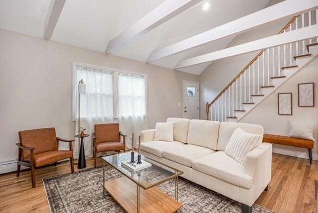 122 Vernon Valley Rd, East Northport, NY 11731 - living room featuring stairs and light wood-style floors