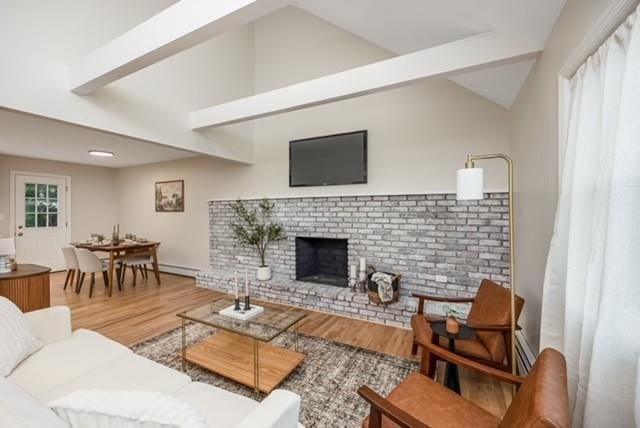 122 Vernon Valley Rd, East Northport, NY 11731 - living area with wood finished floors and a brick fireplace