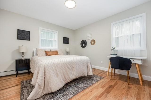 122 Vernon Valley Rd, East Northport, NY 11731 - bedroom with light wood-type flooring and baseboards