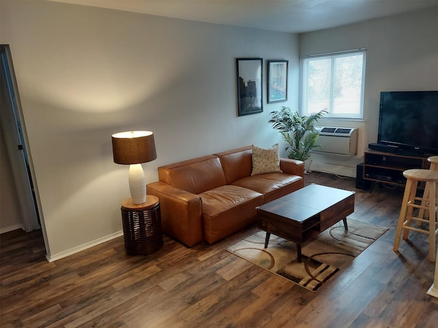 living room with dark hardwood / wood-style flooring and a wall mounted AC