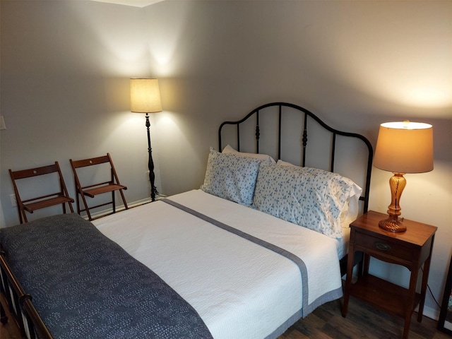 bedroom featuring dark wood-type flooring