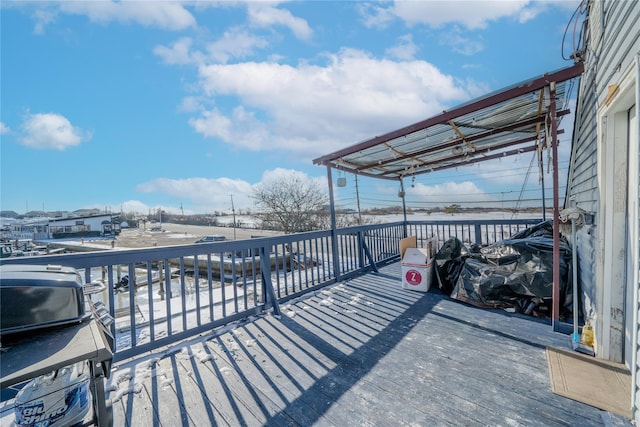 wooden terrace featuring grilling area