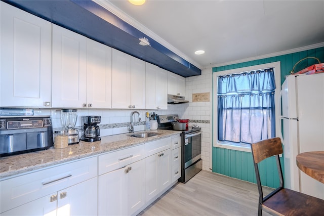 kitchen with electric stove, sink, white cabinetry, white refrigerator, and light stone counters