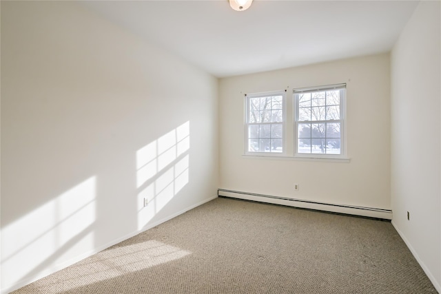 carpeted empty room with baseboard heating