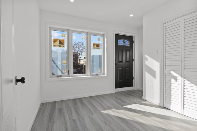 foyer entrance with light wood-type flooring