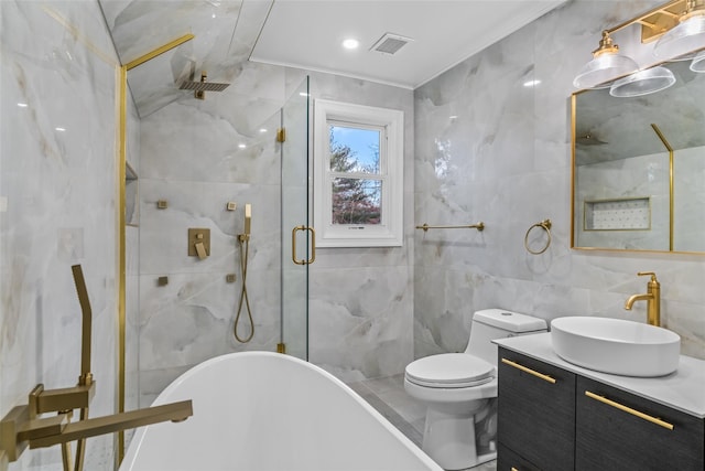 full bathroom with vanity, separate shower and tub, tile walls, and toilet