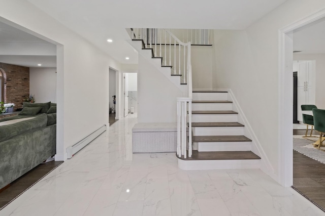 stairway with a baseboard heating unit