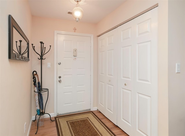 foyer with light hardwood / wood-style floors