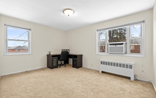 office with cooling unit, light carpet, a wealth of natural light, and radiator heating unit