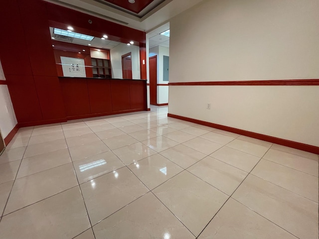 empty room with light tile patterned floors