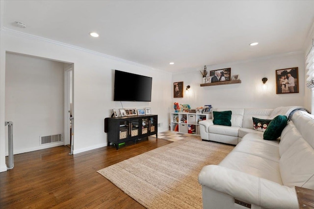 living room with ornamental molding and dark hardwood / wood-style flooring