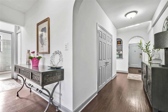 hallway featuring dark hardwood / wood-style flooring