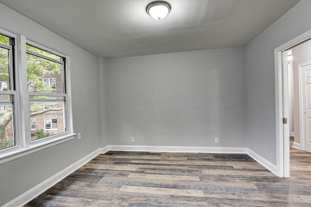 spare room featuring dark hardwood / wood-style flooring