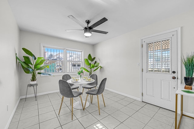 dining room with light tile patterned flooring and ceiling fan